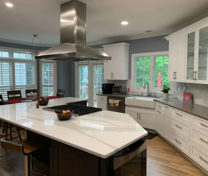 white kitchen with quartz countertops and island