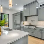 renovated kitchen with grey cabinets and modern island