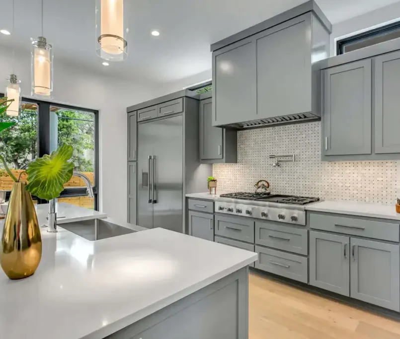 renovated kitchen with grey cabinets and modern island