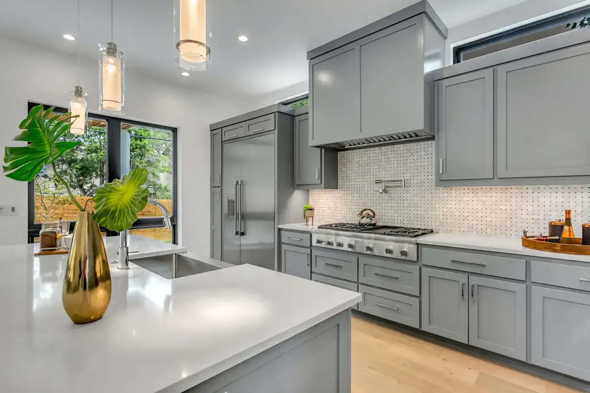 renovated kitchen with grey cabinets and modern island