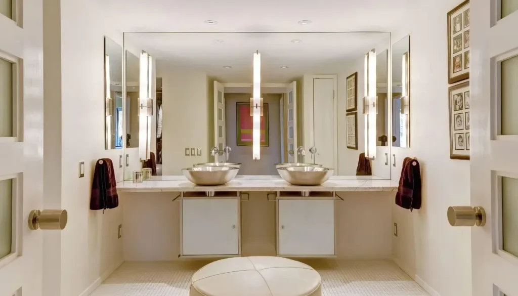 bathroom with large mirrors on walls