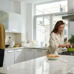 Couples prepares food on quarts vs granite countertops