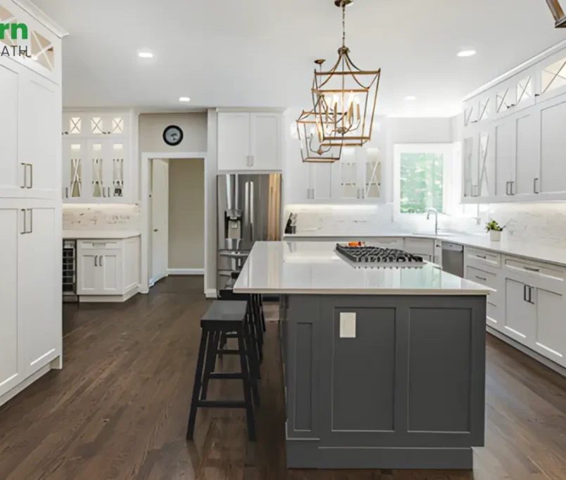 Mid-range kitchen remodel in Herndon VA featuring white shaker cabinets, gray island, quartz countertops, and hardwood flooring by Modern Kitchen & Bath