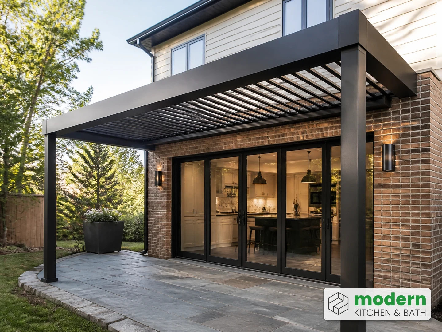 Aluminum louvered pergola attached to a Northern Virginia home with a flashed ledger connection
