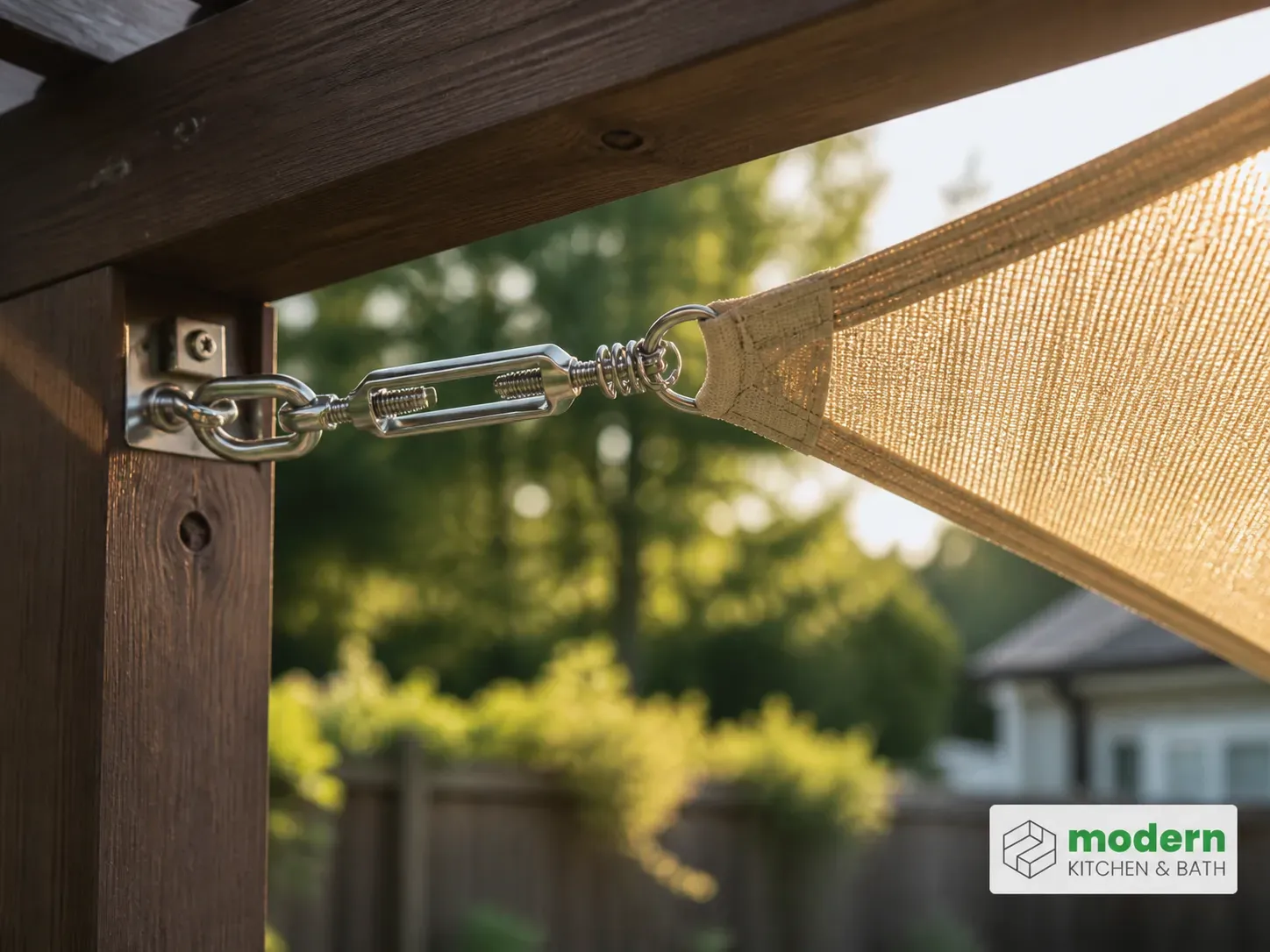Tensioned shade sail corner with stainless turnbuckle and spring hardware on a pergola