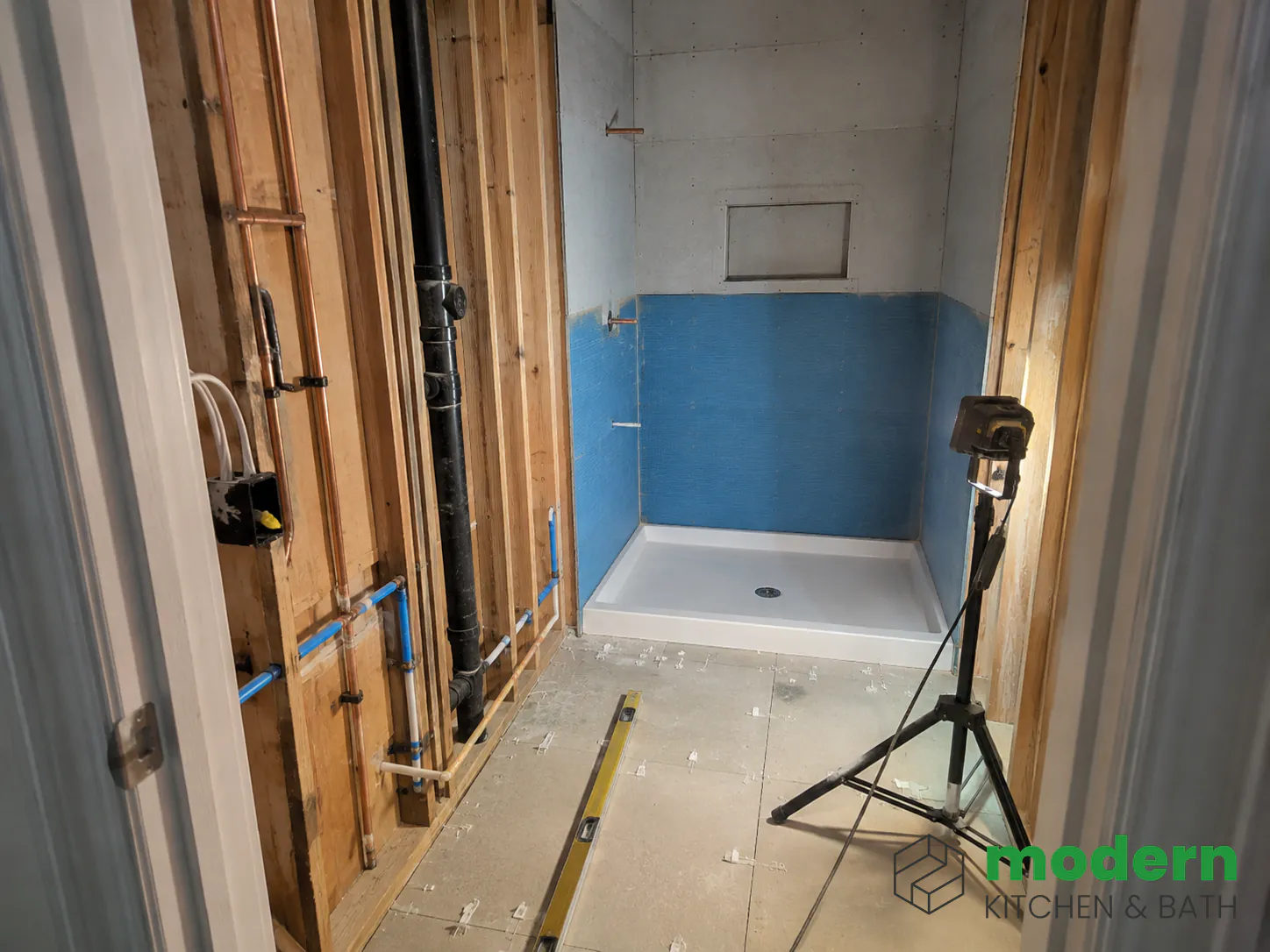 Small 5x7 bathroom mid-renovation showing how tight the working space is for trades